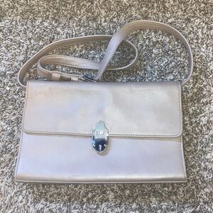 Elegant Silver Crossbody Bag with Jeweled Closure